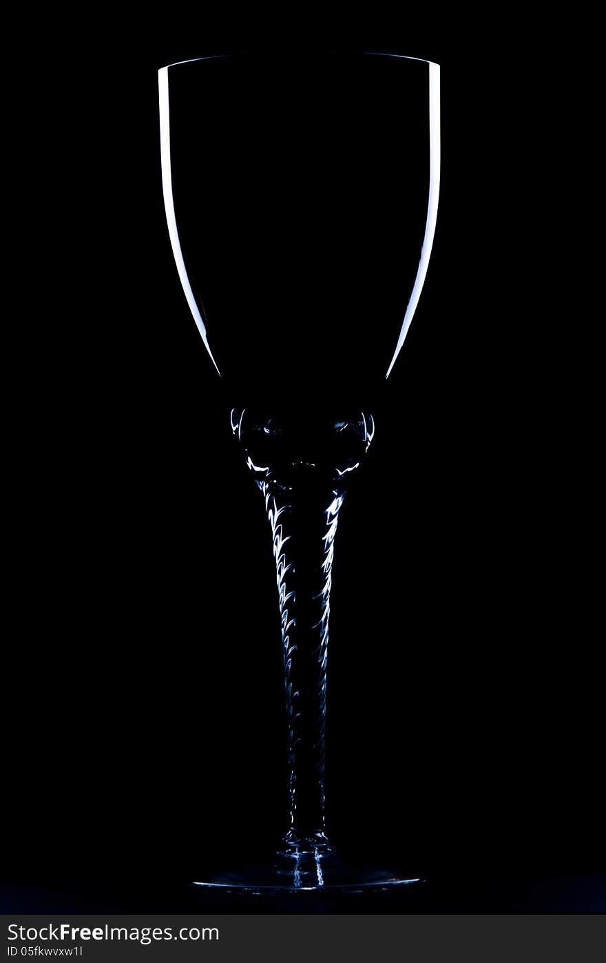 Silhouette of glass on black background.