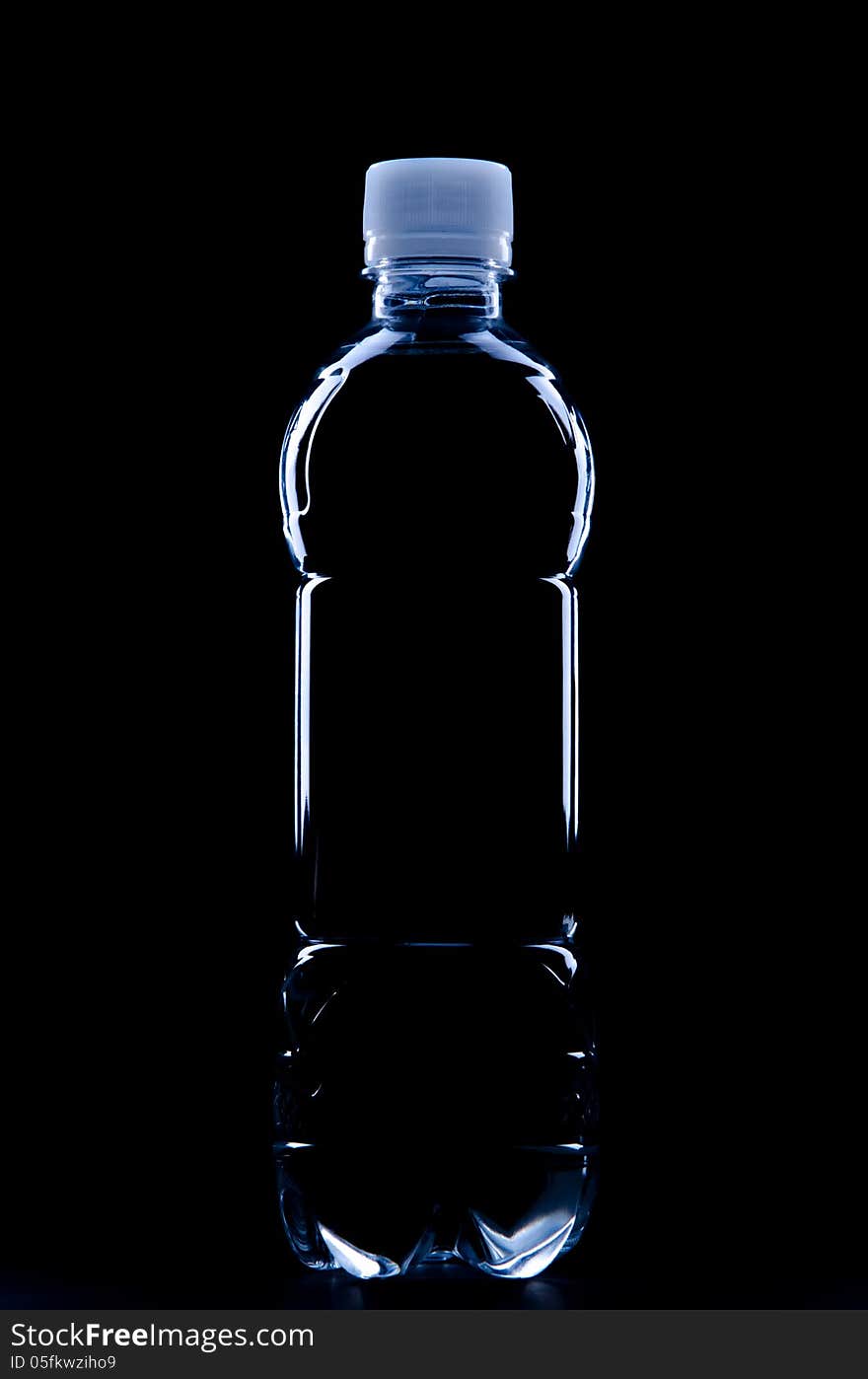 Silhouette of water bottle on black background