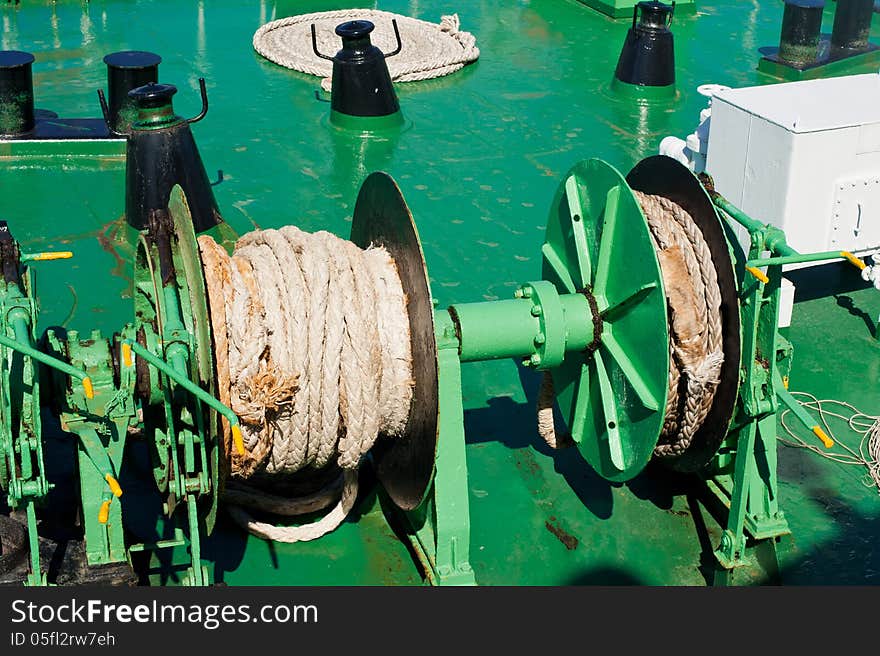 Traveling by sea. Close up rope on mechanism at ferry boat deck. Traveling by sea. Close up rope on mechanism at ferry boat deck