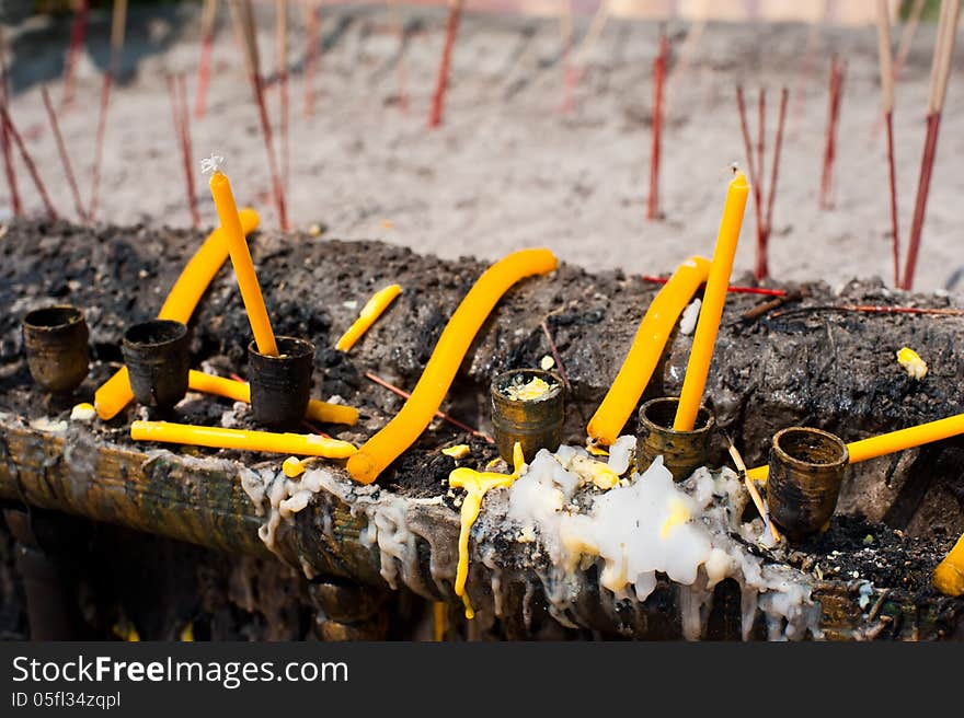 Candles and aroma incense sticks for religion offering ceremony in buddhist temple. Wat Phra Yai. Koh Samui island, Thailand. Candles and aroma incense sticks for religion offering ceremony in buddhist temple. Wat Phra Yai. Koh Samui island, Thailand