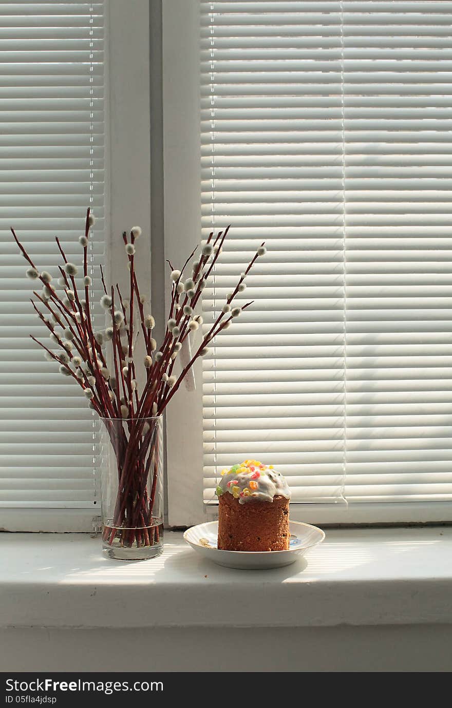 Easter cake and pussy-willow on window sill.