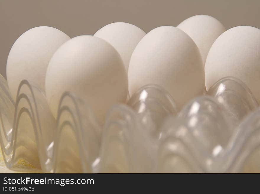 White chicken eggs in plastic package.