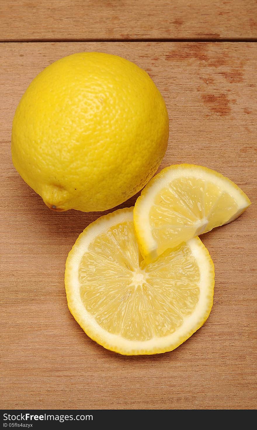 Lemon fruit shot with wooden texture background