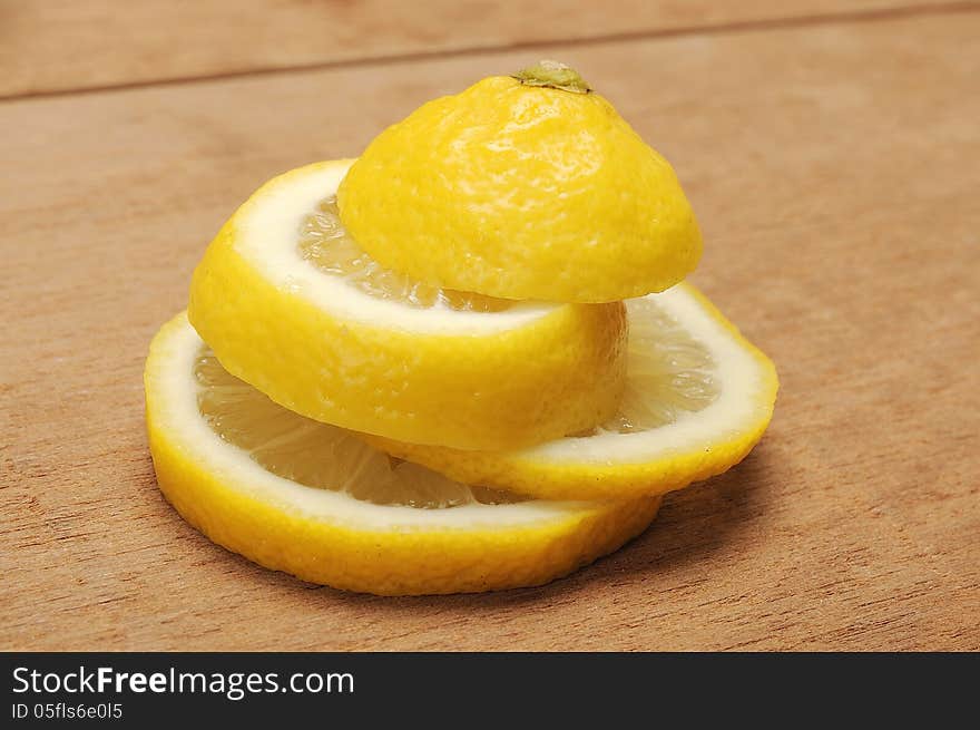 Lemon fruit shot with wooden texture background