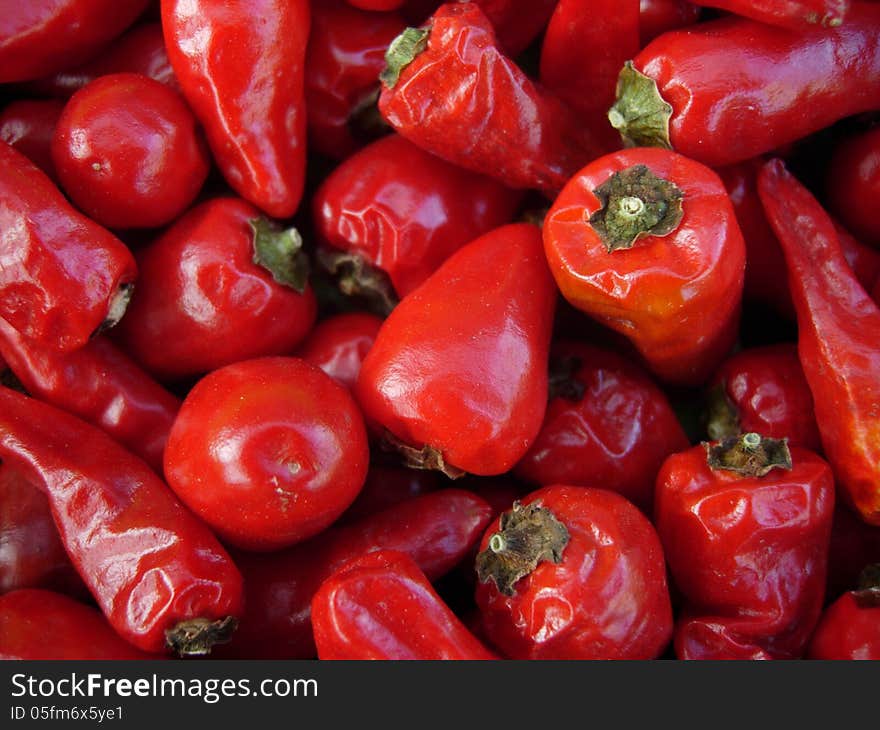 A closeup of a pile of hot peppers