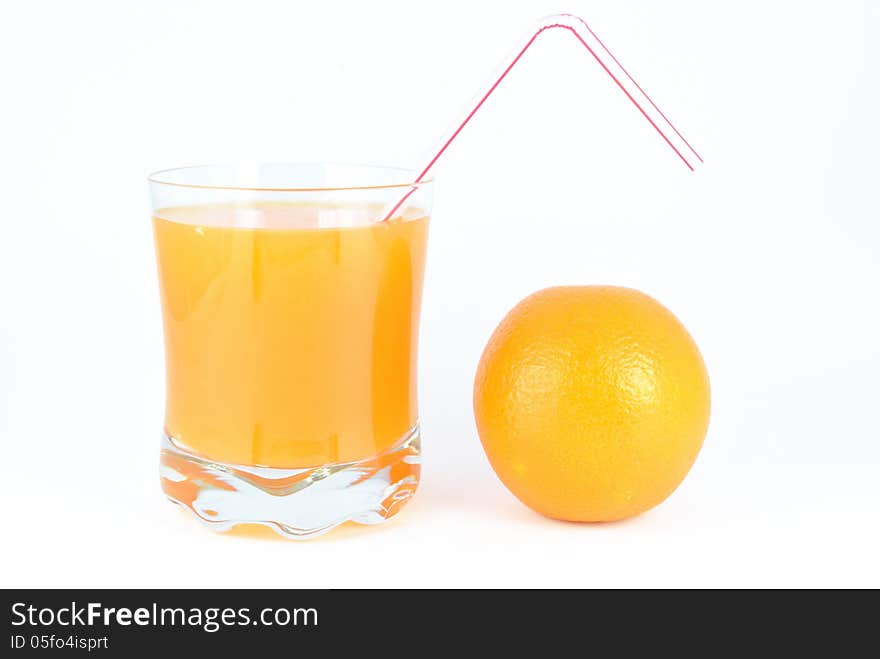 Orange juice and oranges on a white background