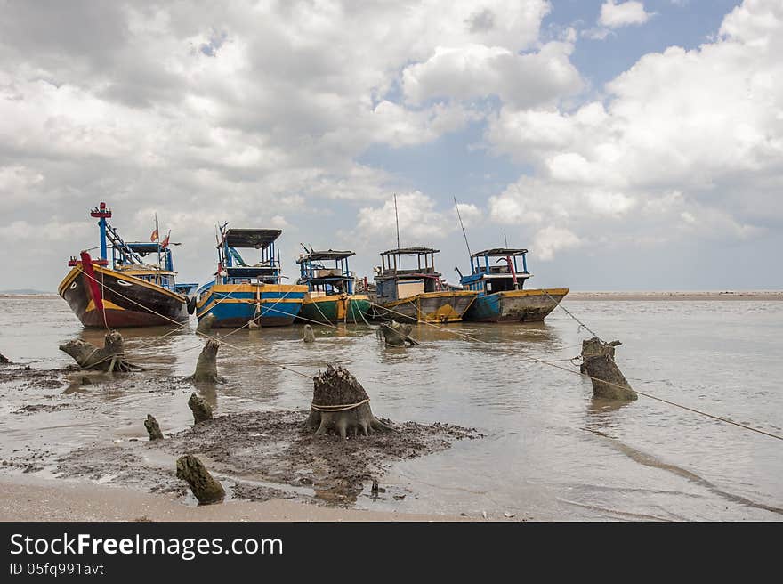 Fishing Boats Anchored Near The Seaside