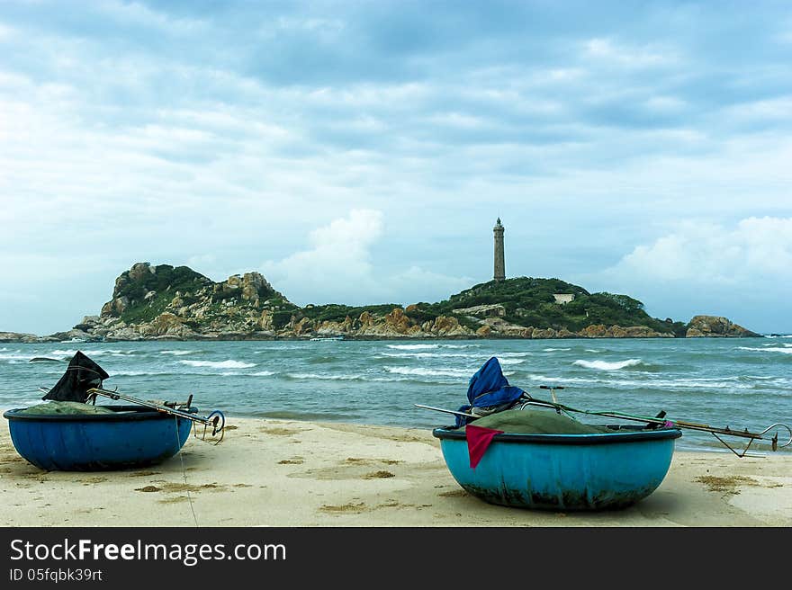 Coracles On The Beach With The Lightjouse Of Ke Ga At Background