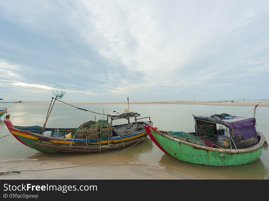 Fishing boats anchored at the shore-line