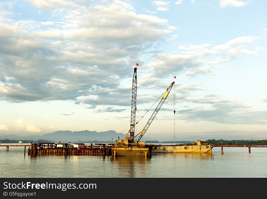 Crane at construction site on river of Hoi An Vetnam