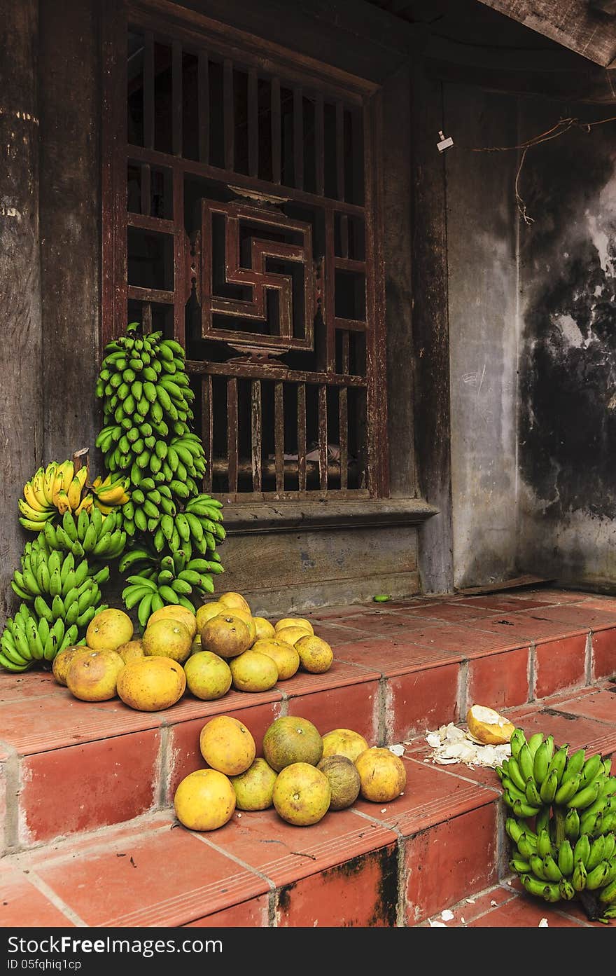 These fruits are selling in front of the farmers house. These fruits are selling in front of the farmers house