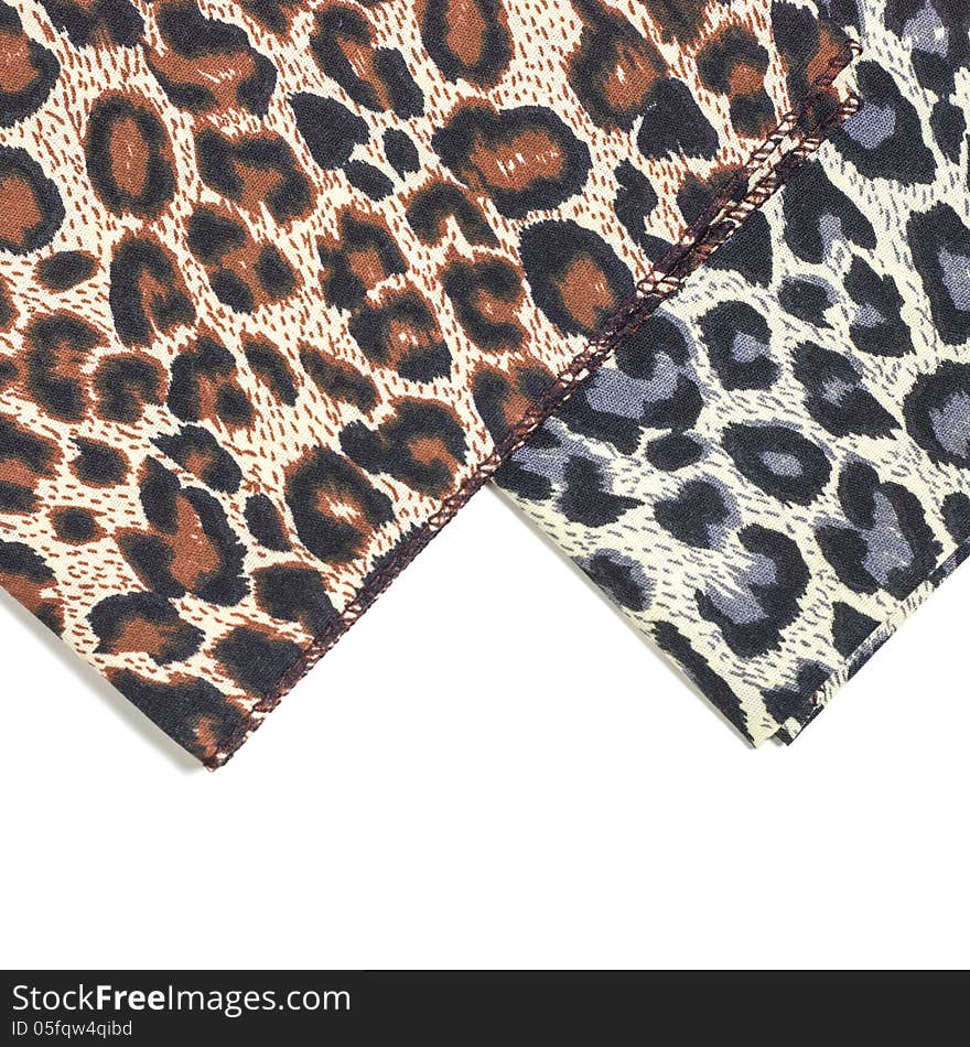 Leopard spots background with fabric texture