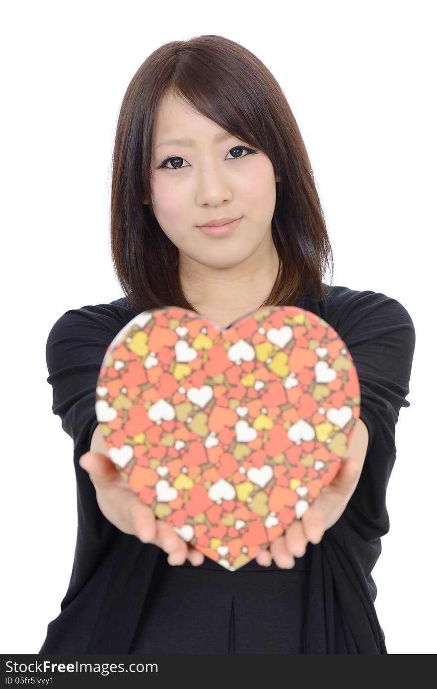 Young asian woman holding a gift box on white background