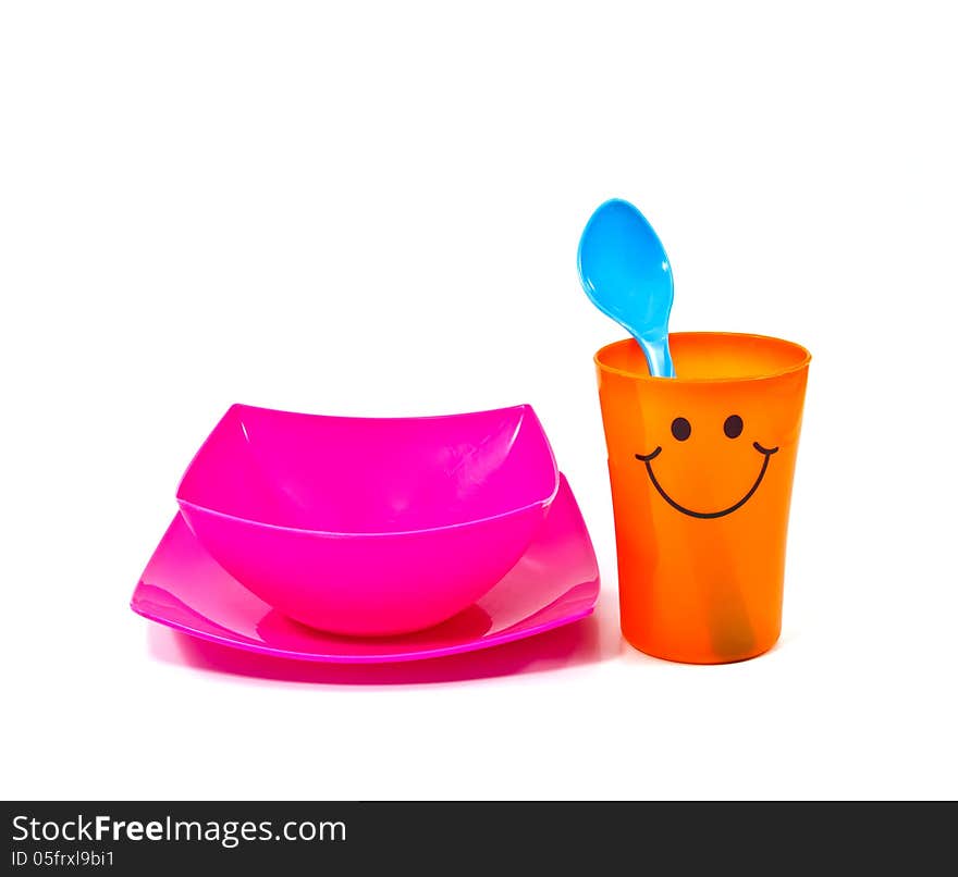 Bright plastic disposable tableware isolated