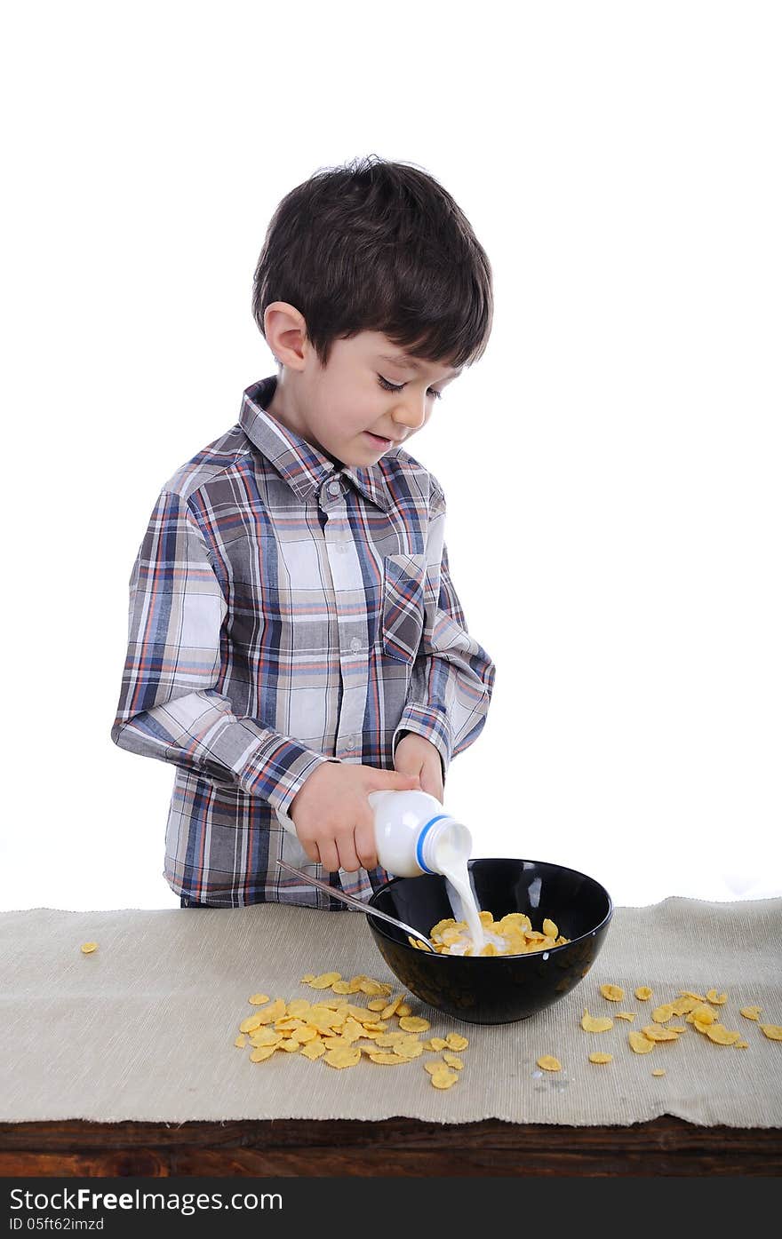 Preparing Breakfast Of Corn Flakes And Milk