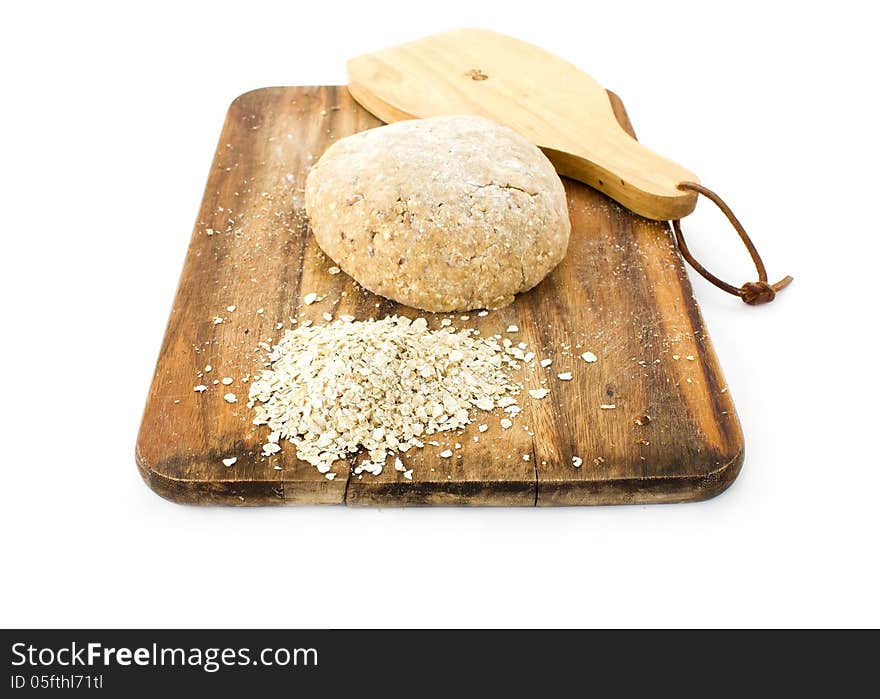 Raw Ball Of Dough On Wooden Board