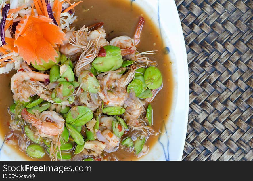 Fried Parkia with shrimp and source.