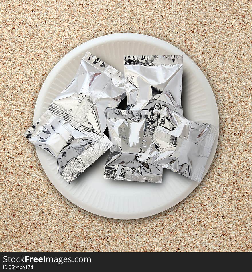 Foil package on white plate