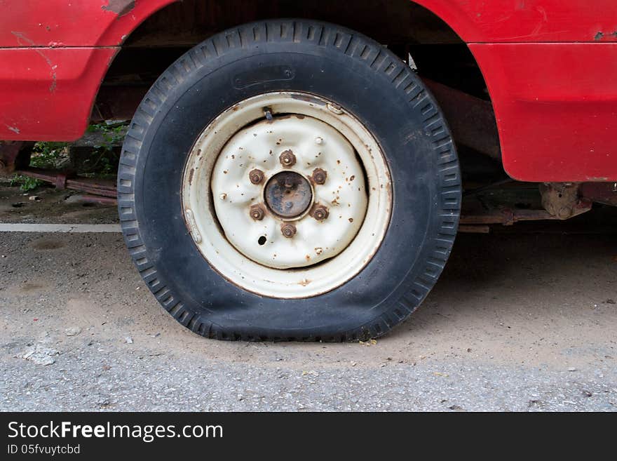 Closeup of flat tire on the road