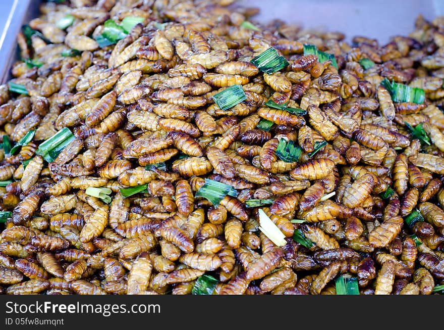 Fried silk worm for sale in a local marke