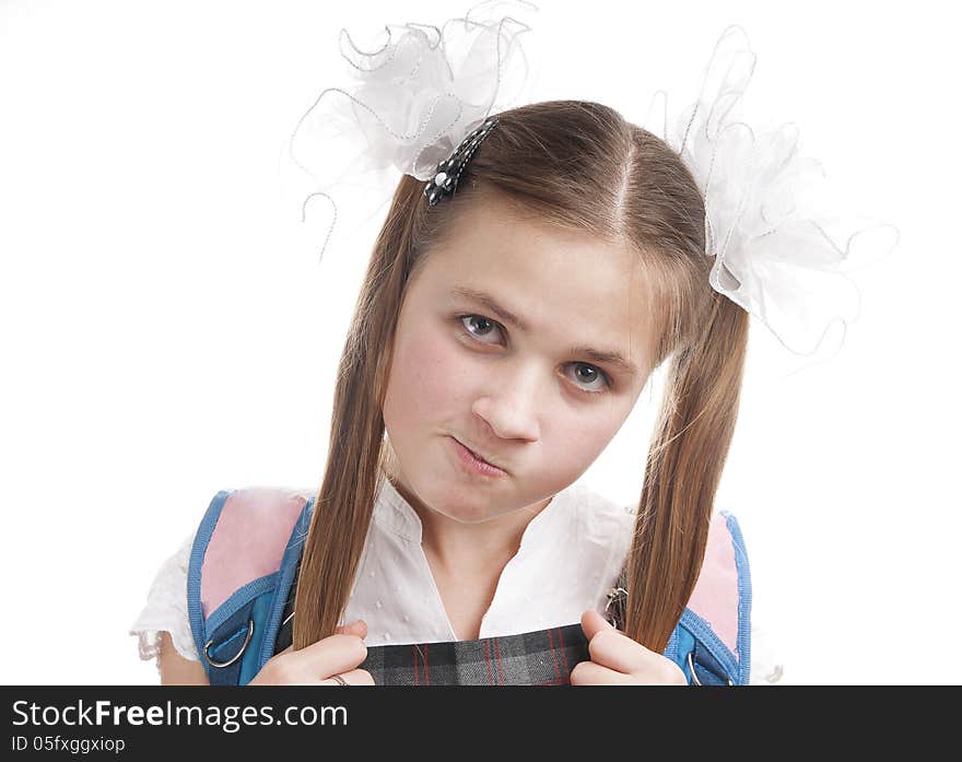 Dissatisfied schoolgirl on white background. Dissatisfied schoolgirl on white background.