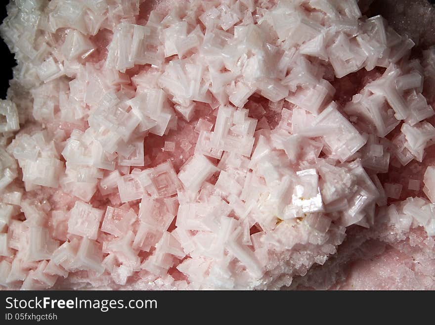 Crystals of pink halite as a background