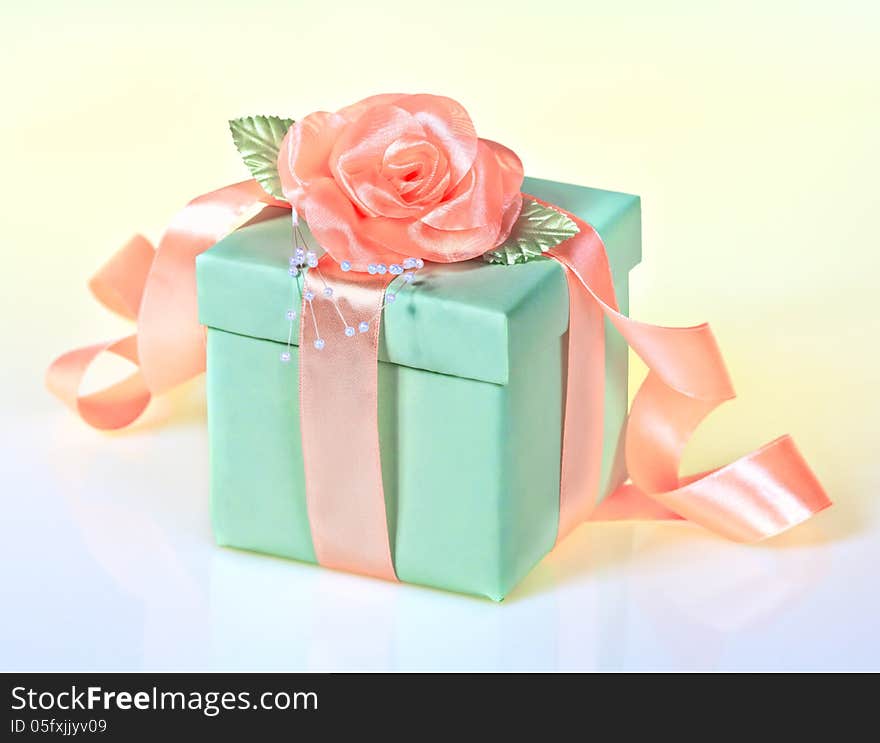 Green gift with rose ribbon