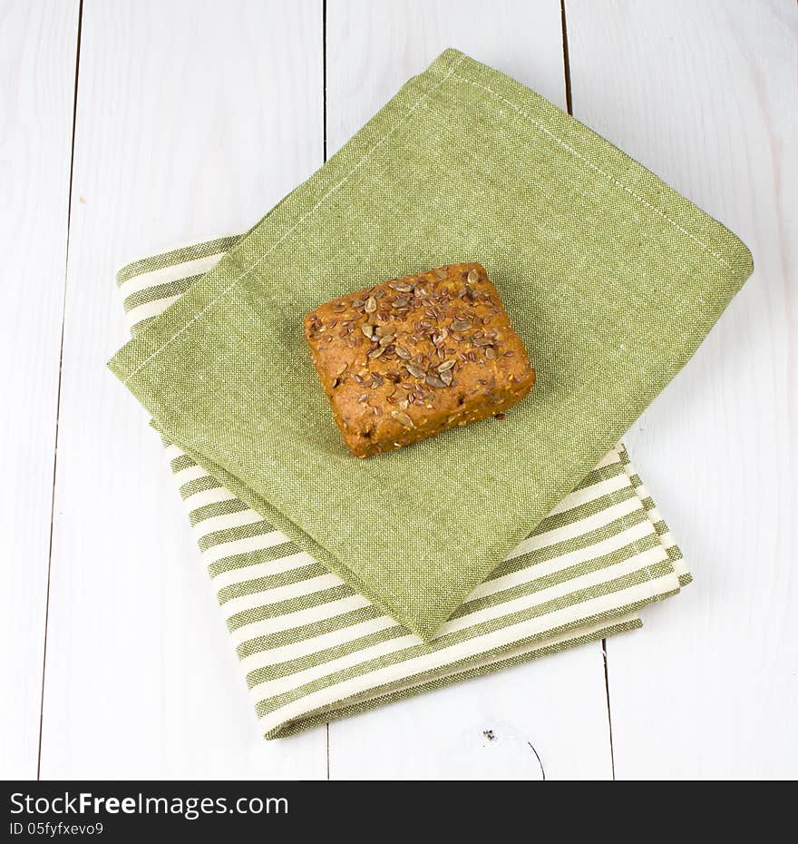 Bread slice on white wooden background. Bread slice on white wooden background