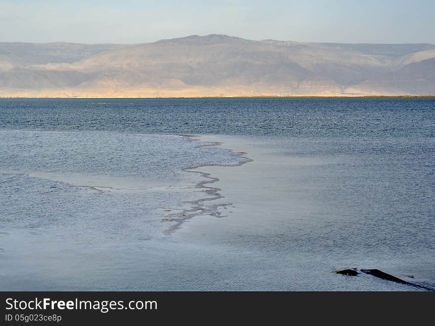 Calm evening at Dead sea coast and Jordan mountains view. Calm evening at Dead sea coast and Jordan mountains view.