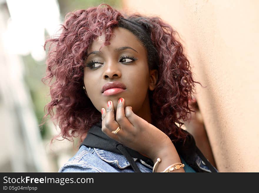 Beautiful Black Woman In Urban Background With Red Hair