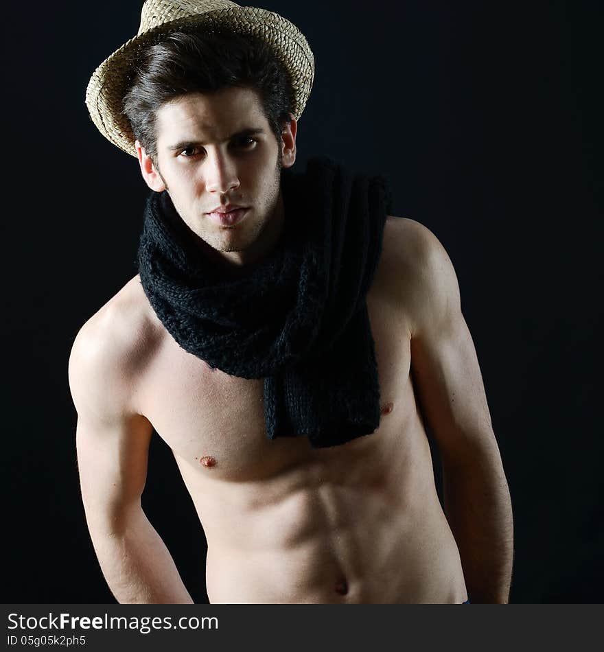 Portrait of handsome man wearing hat and scarf