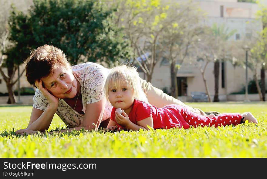 Grandmother and granddaughter playing together outdoors