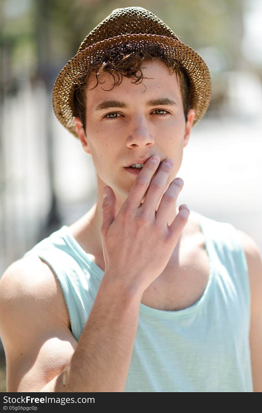 Handsome Man Wearing Sun Hat In Urban Background