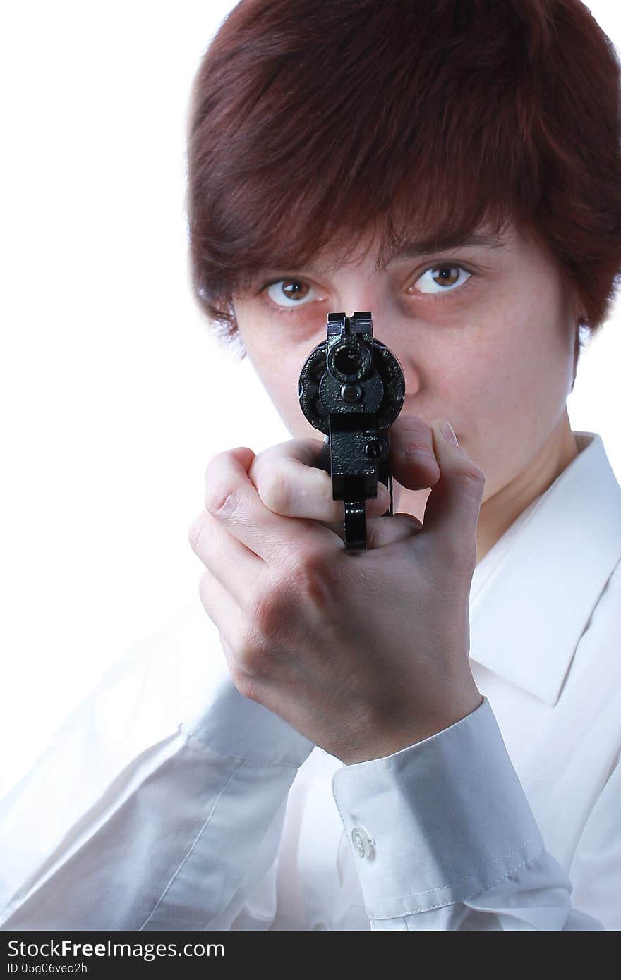 Professional woman who is holding a gun pointing it at a target on a white background. Professional woman who is holding a gun pointing it at a target on a white background