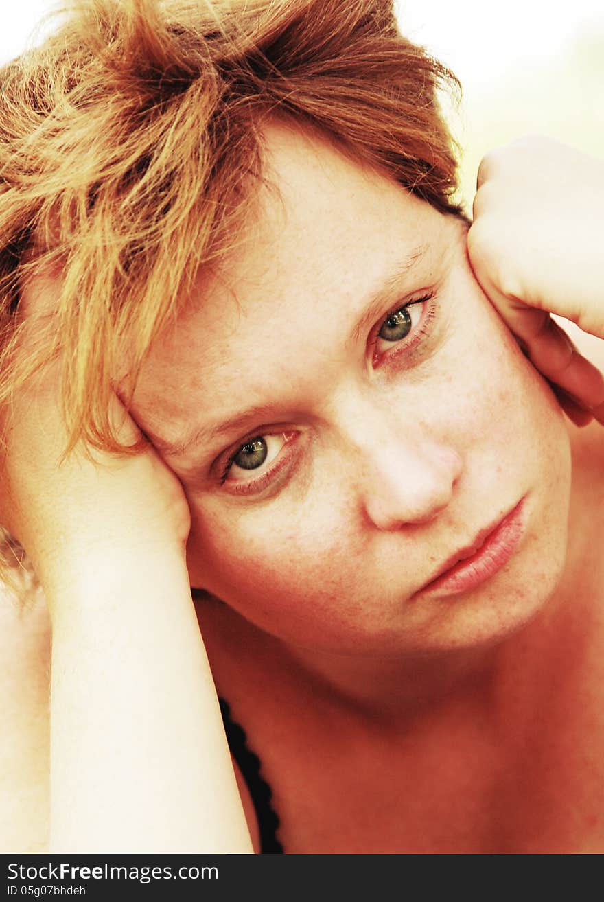 Close up portrait of sad redheaded woman