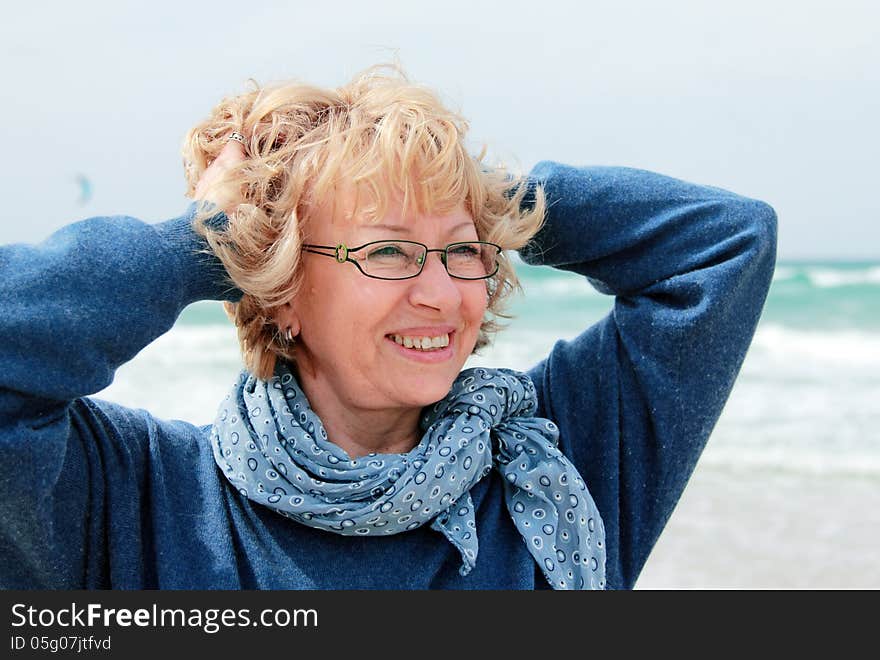 Portrait of happy senior woman at sea