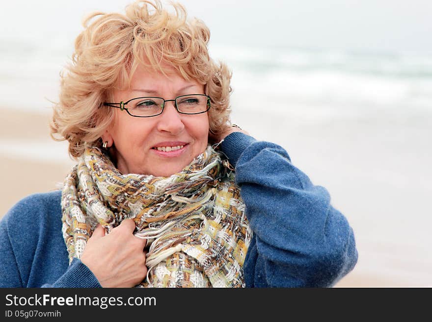 Portrait of happy senior woman at sea