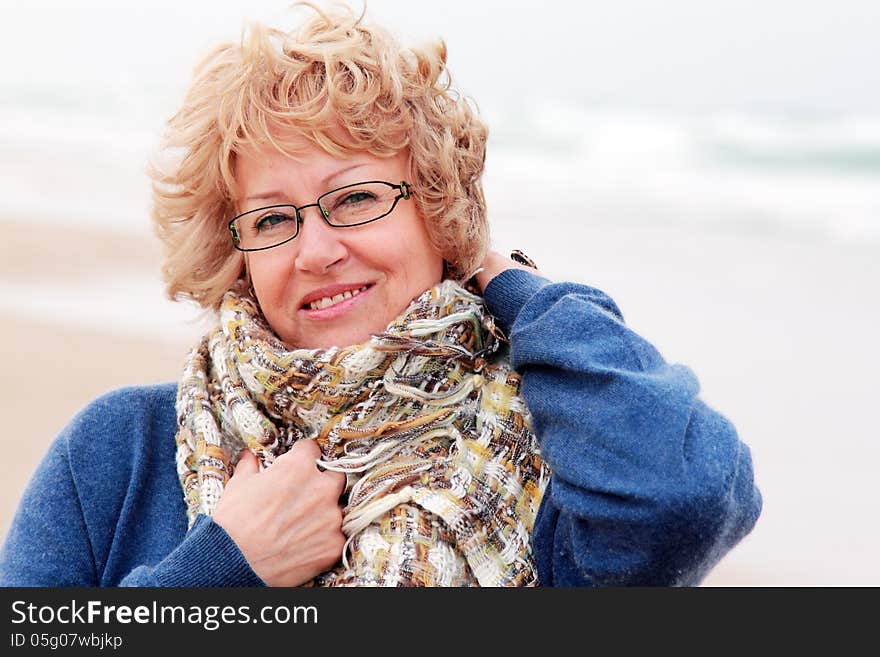 Portrait of happy senior woman at sea