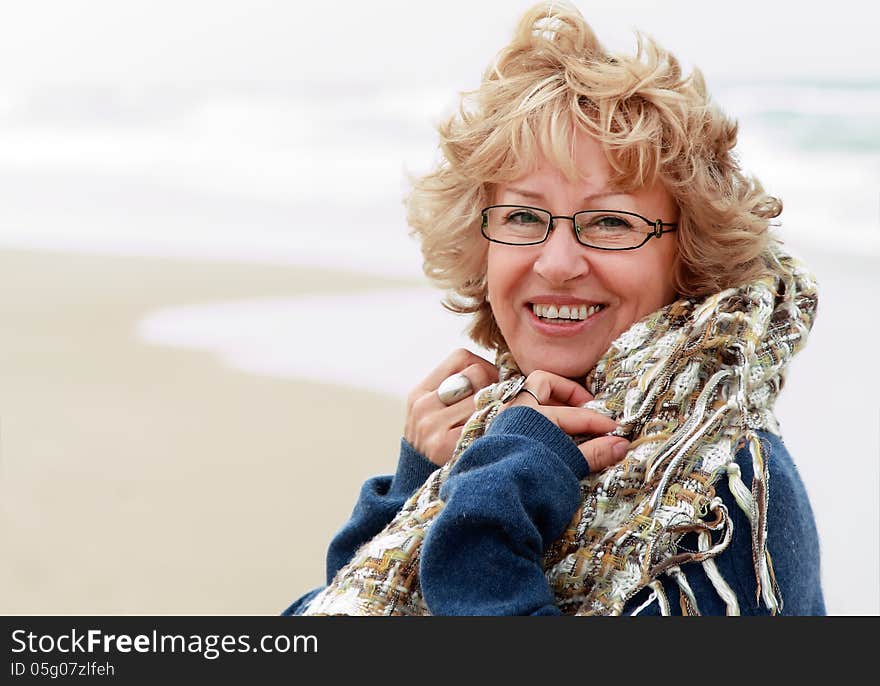 Portrait of happy senior woman at sea