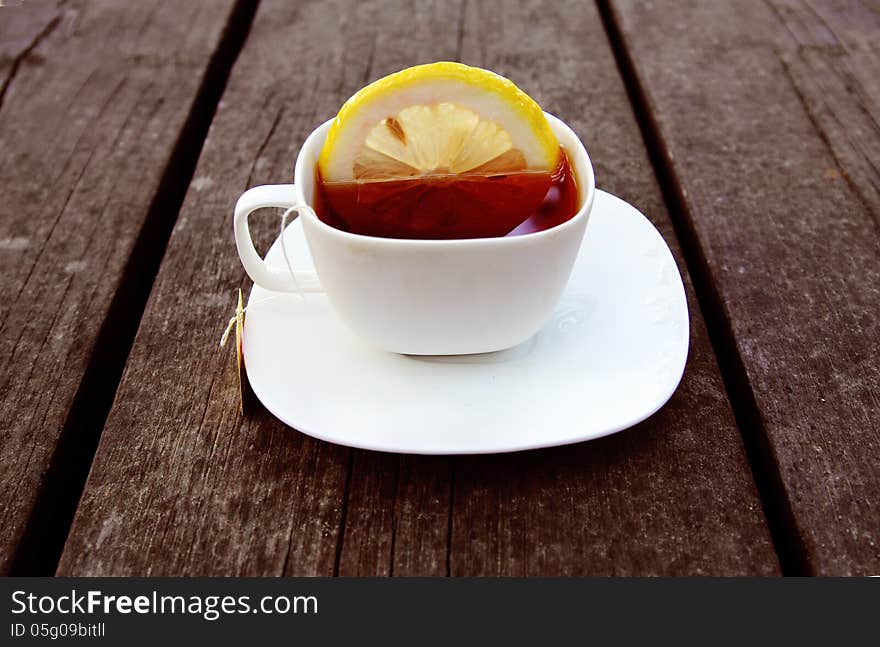 Cup of tea on wooden bachground