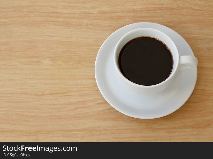 Coffee cup top view on the desk