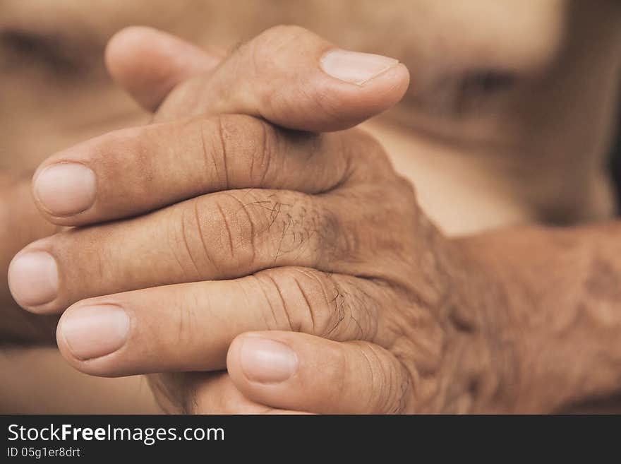 Close up image of old man hand