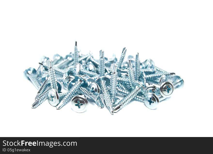 Screws with a drill tip on white background