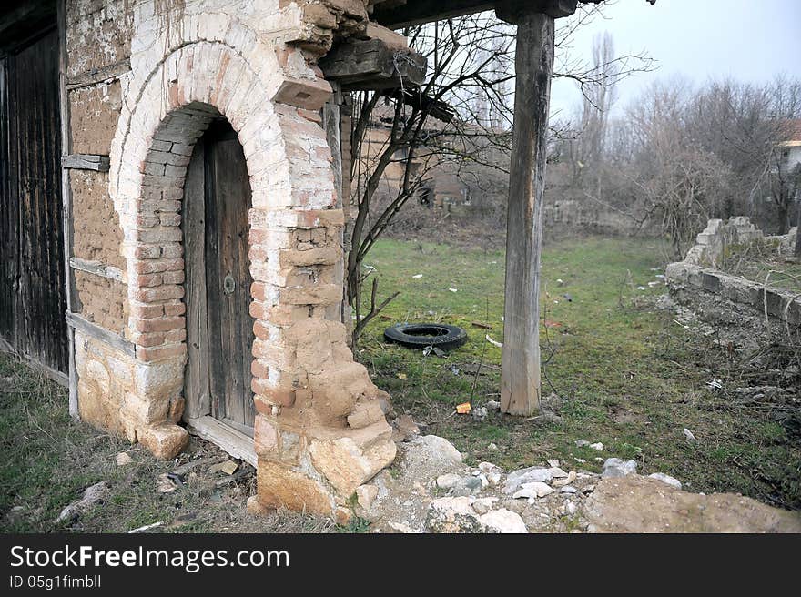 Grunge background texture of demolished building showing scarred walls and door