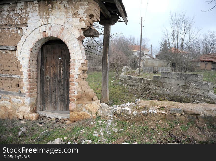 Grunge background texture of demolished building showing scarred walls and door