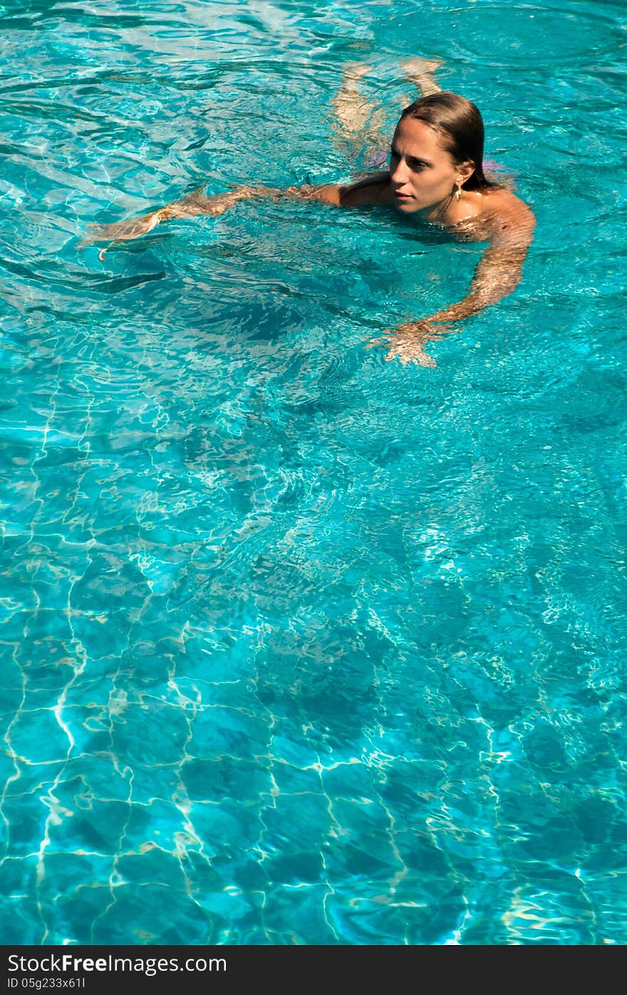 Young woman in the pool. Young woman in the pool