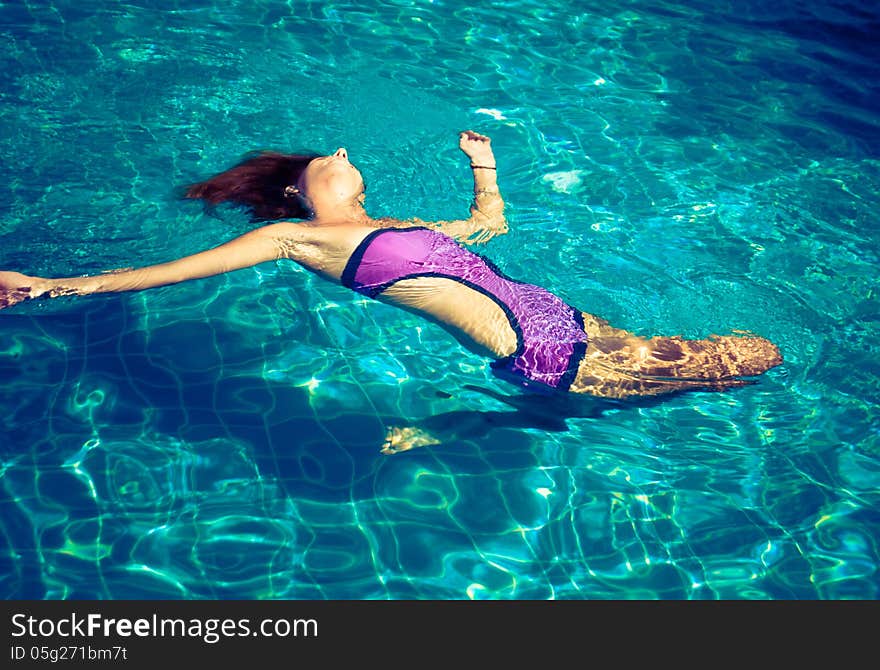 Young woman in the pool. Young woman in the pool