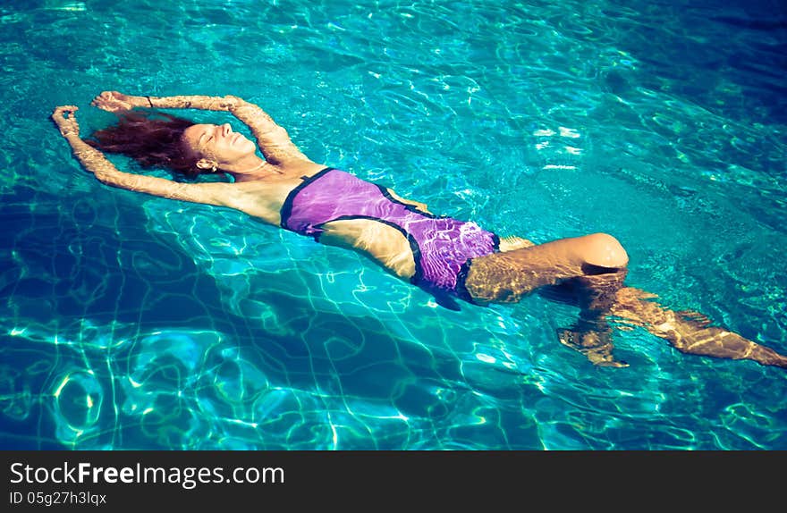 Young woman in the pool. Young woman in the pool