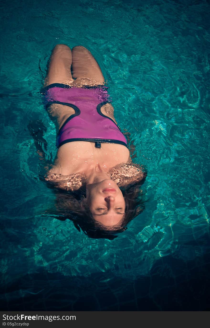 Young woman in the pool. Young woman in the pool