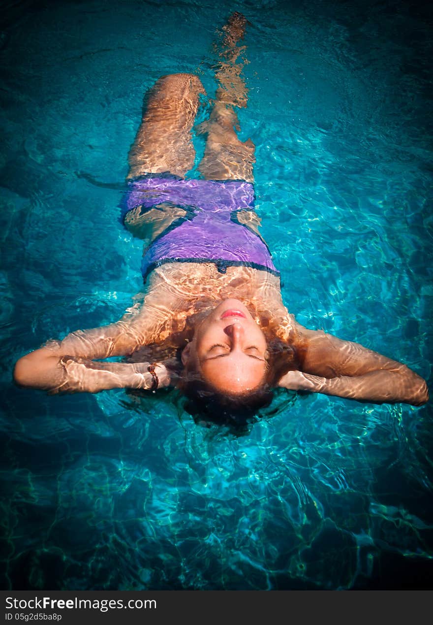 Young woman in the pool. Young woman in the pool